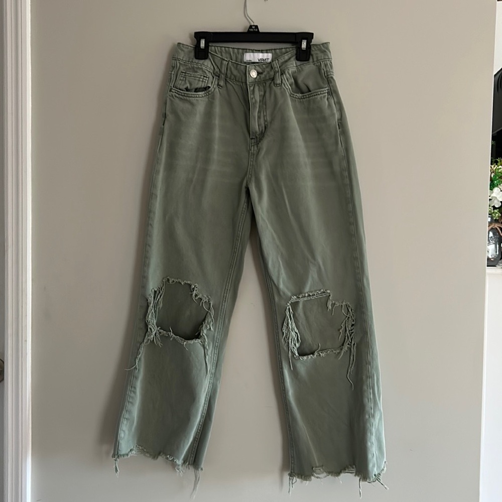 Pale green jeans, size 25 in women’s.